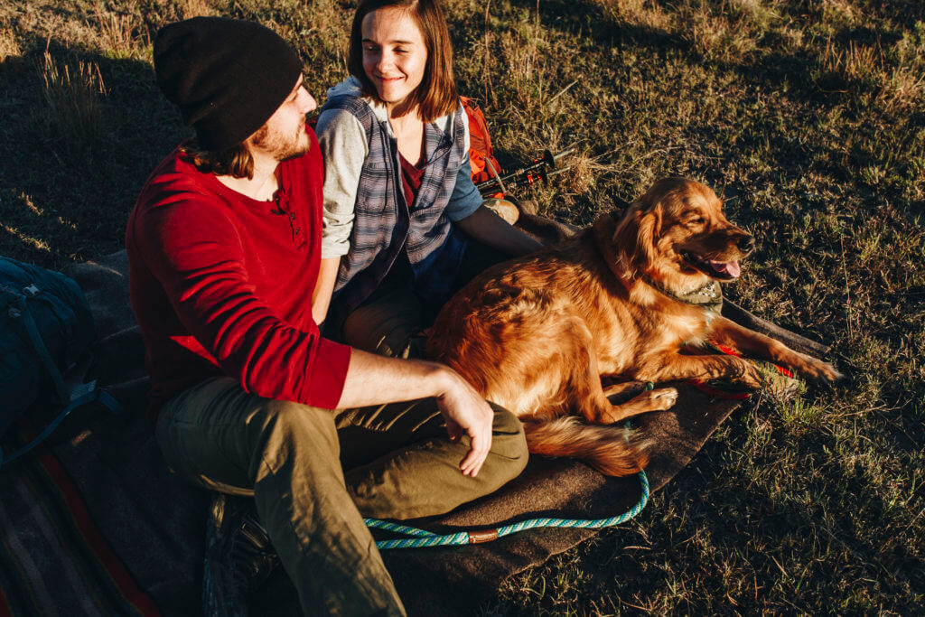 Couple with dog enjoying the outdoors